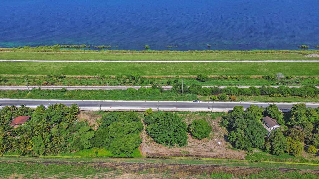 Photo of 14754 Us Highway 441, Canal Point, FL 33438 (MLS # R10987046)
