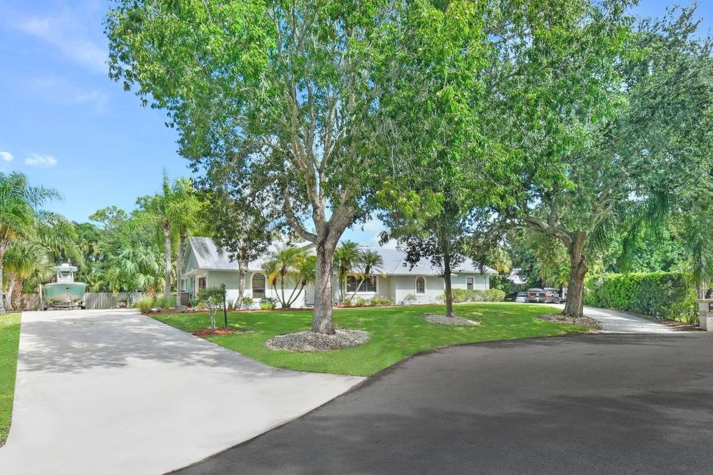 Photo of 1225 SW Magnolia Bluff Drive, Palm City, FL 34990 (MLS # R11128271)