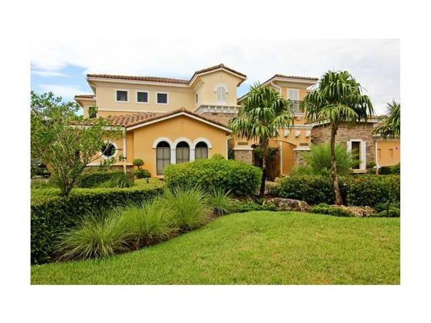 Parkland Golf & Country Club Caseras upstairs unit with private elevator. Kitchen with 42" wood cabinets, stainless steel appliances, and tiled backsplash. Hurricane impact windows & doors. Enjoy golf views from your screened balcony. 2 car garage. Surrou nd sound. Custom window treatments. Crown molding. Built in breakfast area banquette. Country Club with 3 pools, spa, fitness center, tennis, restaurants. Golf membership available.