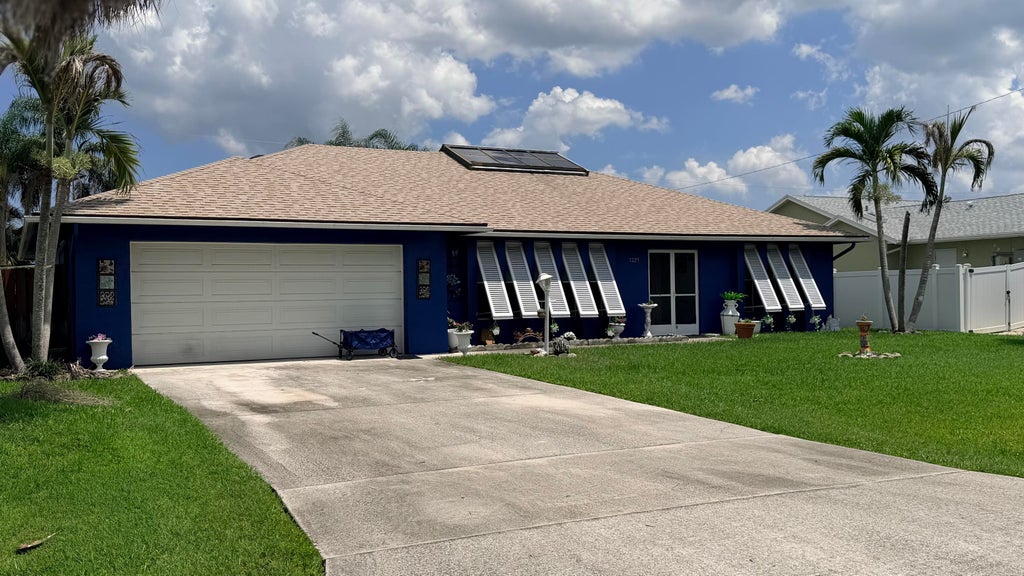 Photo of 1229 SW Cynthia Street, Port Saint Lucie, FL 34983 (MLS # B26067105)