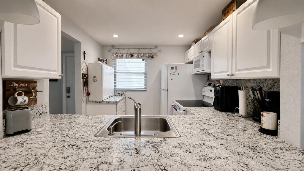 Photo of 9480 Poinciana Place #201, Davie, FL 33324 (MLS # B26069467)
