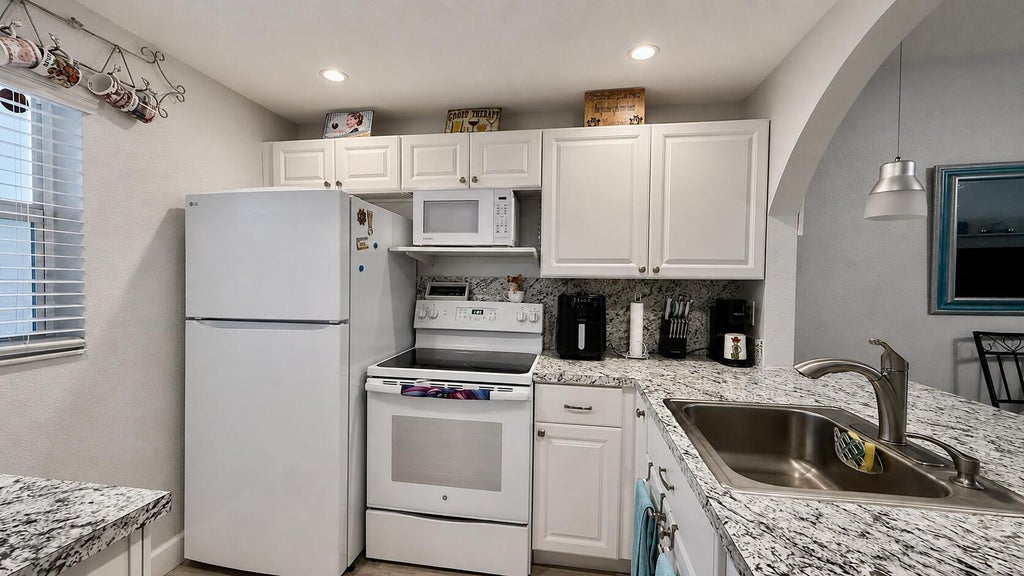 Photo of 9480 Poinciana Place #201, Davie, FL 33324 (MLS # B26069467)