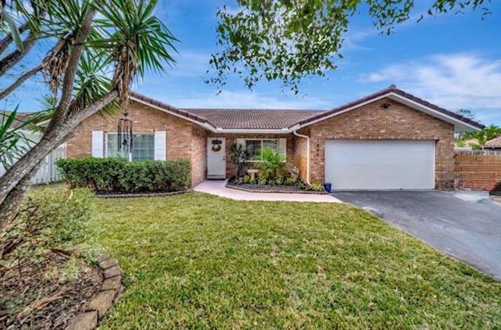 Photo of 1448 NW 112th Way, Coral Springs, FL 33071 (MLS # F10551407)