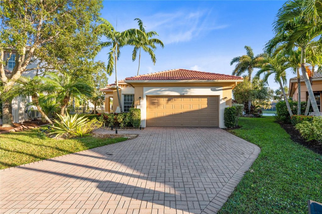 Photo of 12380 NW 77th Manor, Parkland, FL 33076 (MLS # F10483511)