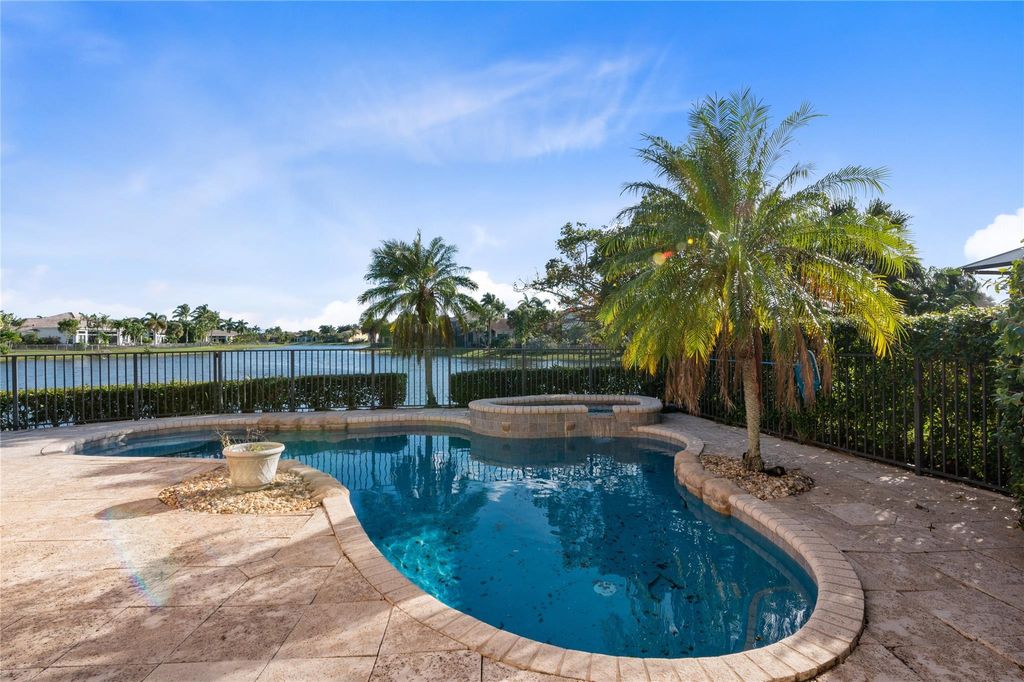 Photo of 12380 NW 77th Manor, Parkland, FL 33076 (MLS # F10483511)