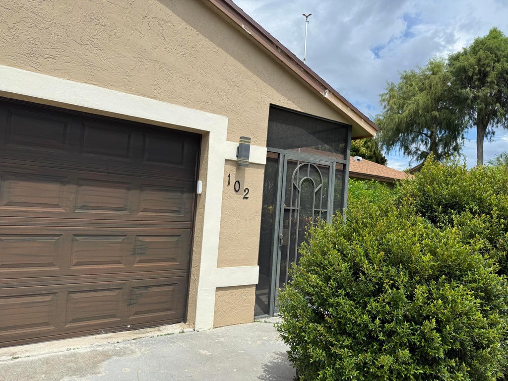 Photo of 102 SAND PINE Way, Royal Palm Beach, FL 33411 (MLS # B26073758)