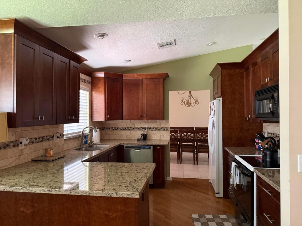 Photo of 102 SAND PINE Way, Royal Palm Beach, FL 33411 (MLS # B26073758)