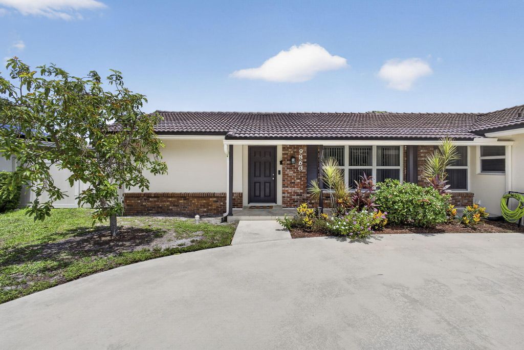 Photo of 9860 Honeysuckle Avenue, Palm Beach Gardens, FL 33410 (MLS # B26049697)