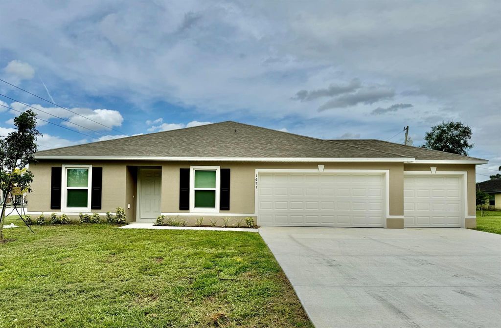 Photo of 1691 SW Andalusia Road, Port Saint Lucie, FL 34953 (MLS # R11030191)