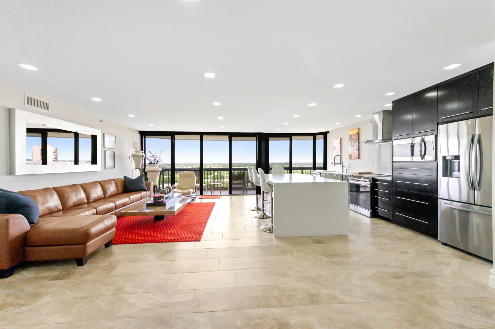 You are invited. The Consulate is a de luxe full service building known as the Grande Dame of the Lands of the President with mind boggling views on the exclusive private Dutchman's Pipe Golf Course and West Palm Beach City Line from the wrap around terrace with full floor to ceiling sliding window doors. Amenities offered at the Consulate are: Full time building manager, 24/7 white glove Concierge, 2 man maintenance crew, golf valet 7 days from 5 to 11 PM, beautifully renovated lobby and club room, Top of the line Gym, large lap pool w/ spa and sun area, Tennis court/pickle ball/basket ball ring, one deeded carport per apt, party room, library, bike storage, extra storage cage. HOA also includes cable + internet, nowhere else offered service contract on appliances and light plumbing