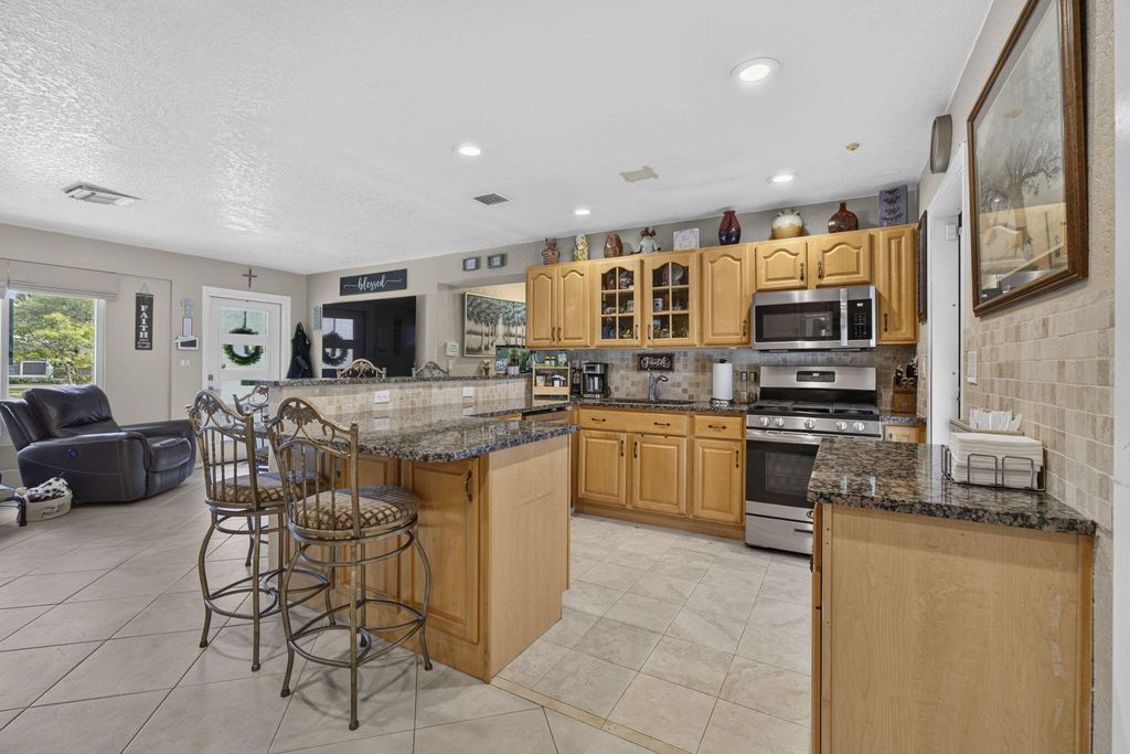 Photo of 240 GREGORY Road, West Palm Beach, FL 33405 (MLS # B26053905)