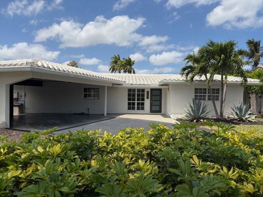 POOL HOME! Spectacular newly renovated 3BR/2BA open-concept retreat featuring quartz countertops, stainless steel appliances, and modern finishes throughout. Expansive windows fill the home with natural light and overlook a serene, tropical landscaped private yard—Pool/ Above Ground Hot Tub perfect for relaxing or entertaining. Includes water purification system newer washer/dryer and garbage disposal. Located in the quiet, sought-after Ridge Knoll neighborhood near beaches, restaurants, and shopping.
