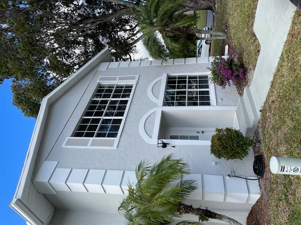 Well maintained corner unit, with extended screen porch. Concrete block construction with concrete between floors. Hardwood floors throughout the main floor. Stainless steel appliances - Granite countertops in the kitchen, bathrooms and laundry room. Great view of the pool. This home has been meticulously maintained and will not last. Owners in this community may park a Boat, Jetski, or camper upon availability for $35 / month! This home may be viewed 7 days a week.
