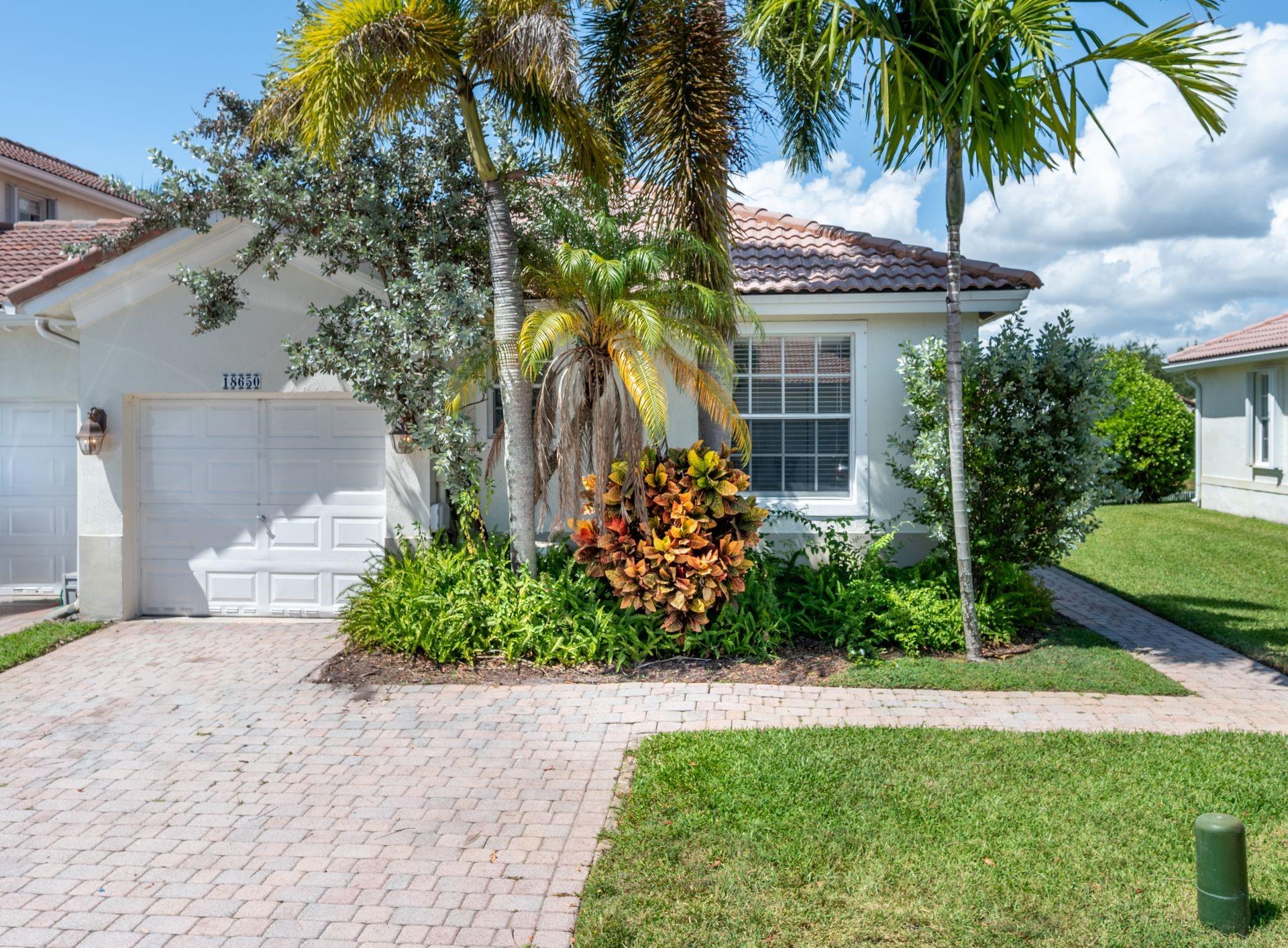 Welcome to this beautifully renovated corner villa located in the sought-after Grand Key community at Sunset Lakes. Boasting a prime location and serene lake views, this move-in ready home offers modern comfort and convenience. Step inside to find laminate wood flooring throughout, complemented by brand-new appliances, updated bathrooms, and a gourmet kitchen with quartz countertops. Acces to Sunset Lakes Club House!. Enjoy the privacy and natural light of a corner unit, with easy access to top-rated A schools, Publix, parks, dining, and major highways. Whether you're relaxing on your patio overlooking the water or exploring the best of the neighborhood, this villa offers it all. Don’t miss this rare opportunity—schedule your private showing today! Vacant and EZ to show!