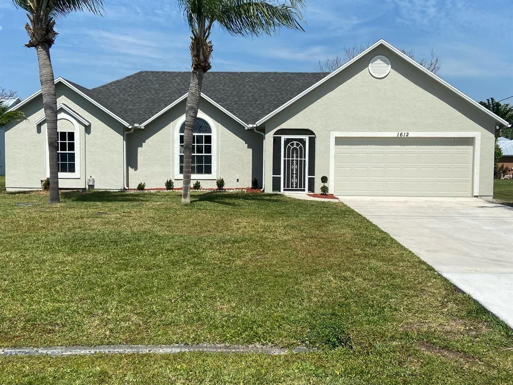 Photo of 1612 SE Berkshire Boulevard, Port St Lucie, FL 34952 (MLS # R10874882)