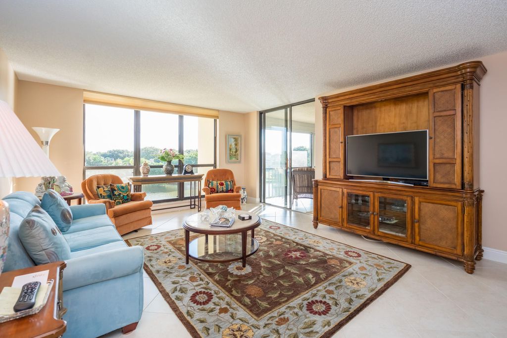 Photo of 5188 Woodland Lakes Drive #335, Palm Beach Gardens, FL 33418 (MLS # B26028609)