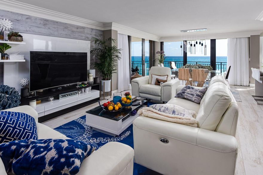 Direct Oceanfront, fully renovated two-bedroom, two-bathroom condo ready for immediate occupancy. Extraordinary water views from this spacious apartment with wraparound balcony, beautifully remodeled with porcelain tile and hardwood floors, chef's kitchen, upgraded appliance package, Hurricane impact doors and windows, washer and dryer in the unit, etc. Seagrape Tower offers a heated pool and hot tub, clubhouse, tennis court, fitness room and BBQ area. The building consists of 60 units, with 4 per floor. The roof, pool, garage, & sports deck have recently been renovated. Steps to PGA Blvd's shopping, restaurants and nightlife. Owners may rent right away. Fantastic investment opportunity.