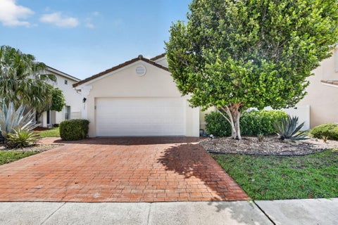 Photo of 7642 N Blue Spring Drive, Parkland, FL 33067 (MLS # B26036352)