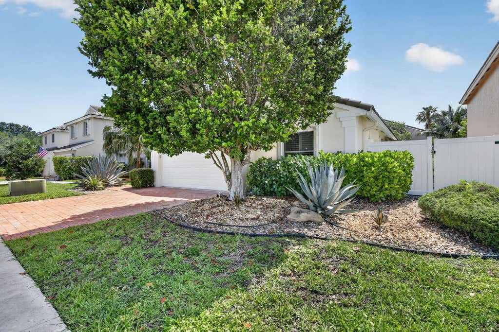 Photo of 7642 N Blue Spring Drive, Parkland, FL 33067 (MLS # B26036352)