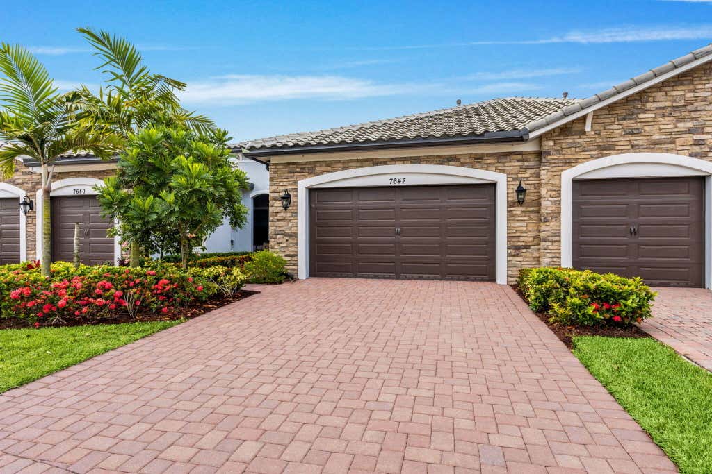 Photo of 7642 N Blue Spring Drive, Parkland, FL 33067 (MLS # B26036352)