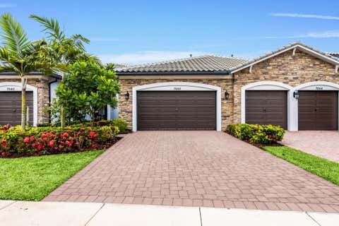 Photo of 7642 N Blue Spring Drive, Parkland, FL 33067 (MLS # B26036352)