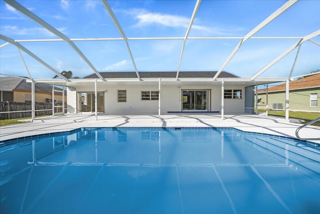 Photo of 408 SW Holden Terrace, Port Saint Lucie, FL 34984 (MLS # R10944506)