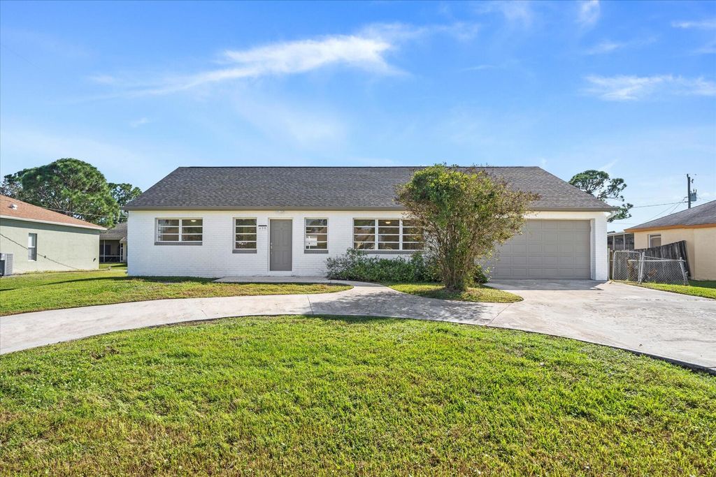 Photo of 408 SW Holden Terrace, Port Saint Lucie, FL 34984 (MLS # R10944506)