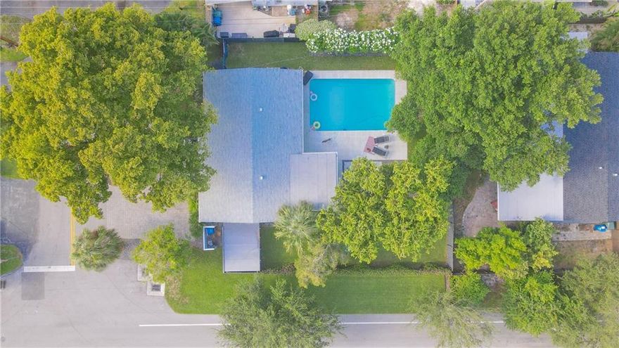 Breathtaking 4 bed /2 bath mid century modern home appointed on an oversized DREAM corner lot in desirable Coral Heights! This Jewel was expertly renovated in 2017 with permits, down to the drywall and features a newer roof 2016, newer HVAC system, tankless water heater, impact windows & doors, redesigned kitchen with shaker cabinets, peninsula w/ modern stone waterfall countertop, SS appliances, updated baths with stone & glass tile backsplash & frameless glass enclosures, porcelain floors throughout the entire home and 192 feet of added square footage! MASSIVE fairytale backyard w/ gorgeous Oak trees, an oversized pool resurfaced w/diamond brite, large entertaining deck, newer fence and plenty of space to sprawl out! *4th bedroom currently used as the formal dining room*