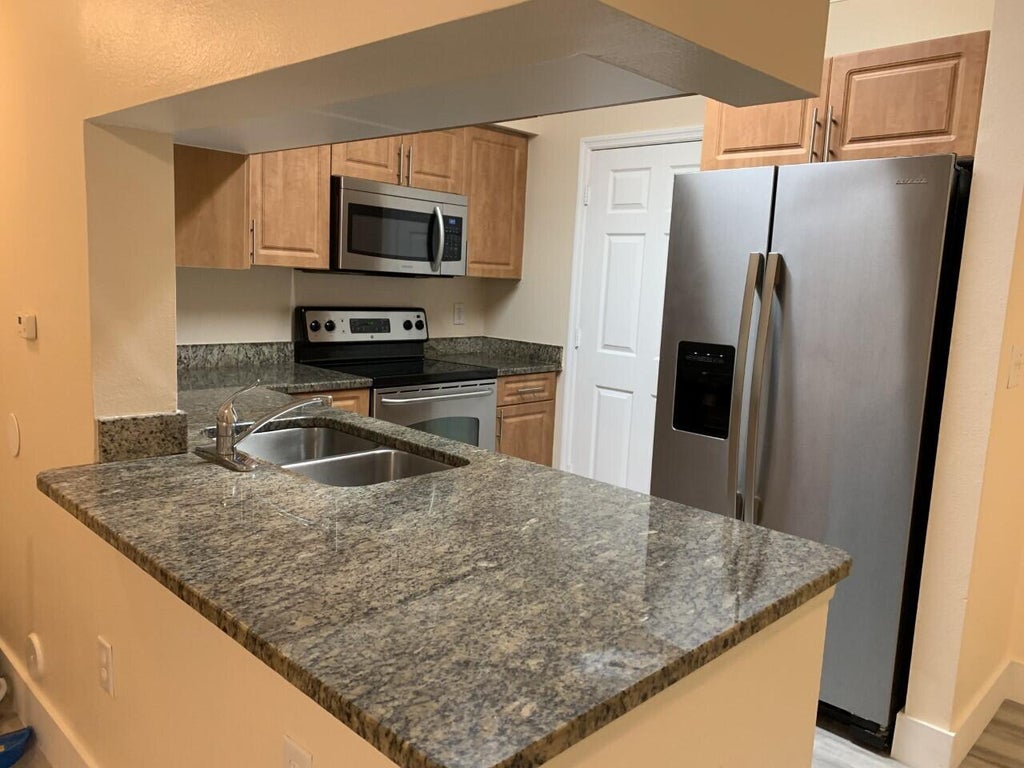 Photo of 6530 Emerald Dunes Drive #108, West Palm Beach, FL 33411 (MLS # R11038281)