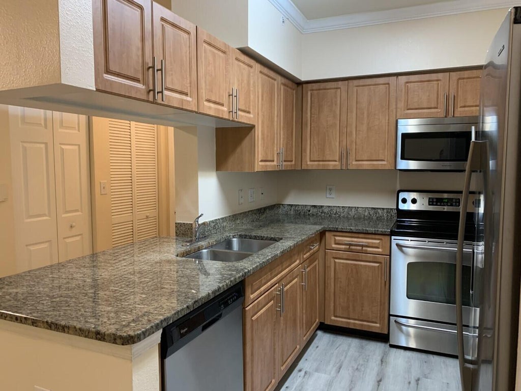 Photo of 6530 Emerald Dunes Drive #108, West Palm Beach, FL 33411 (MLS # R11038281)
