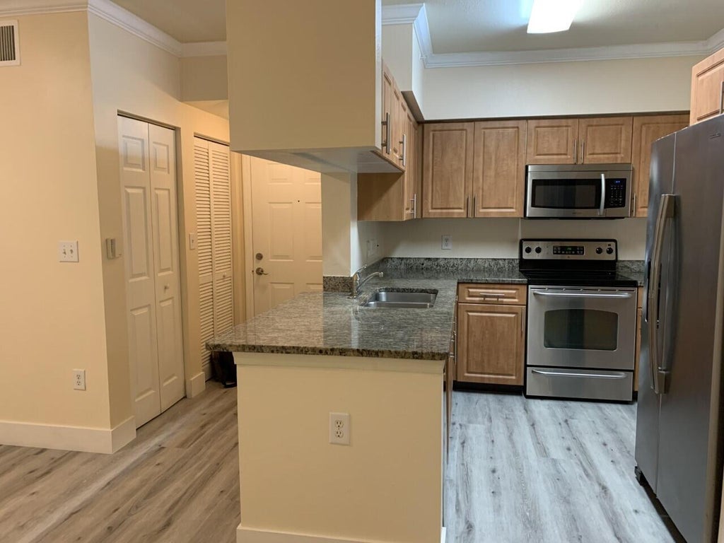 Photo of 6530 Emerald Dunes Drive #108, West Palm Beach, FL 33411 (MLS # R11038281)