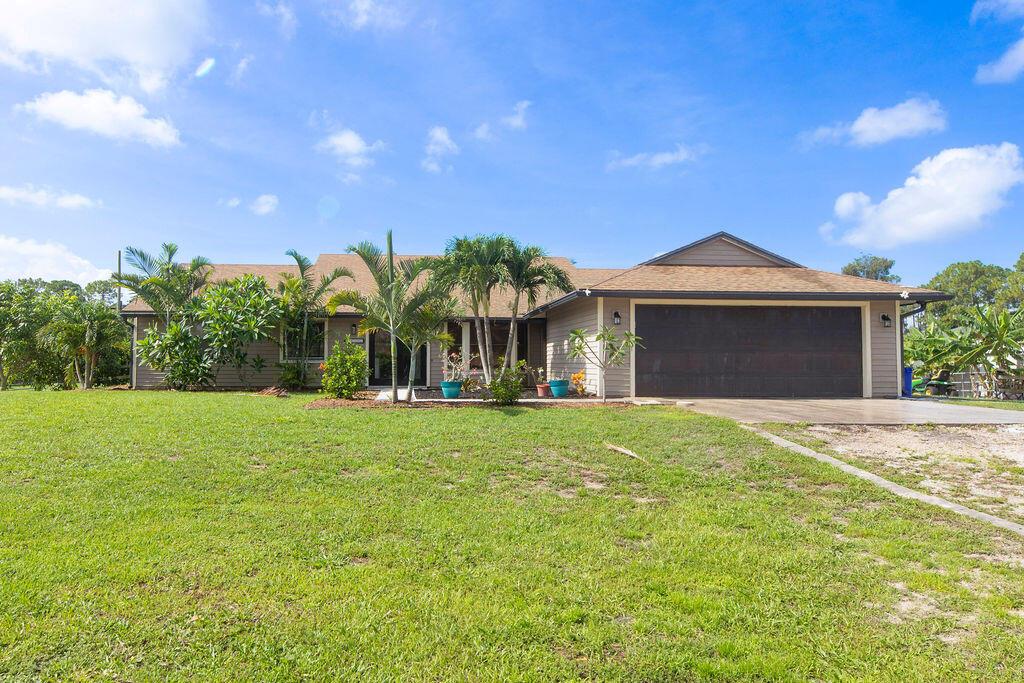 Welcome to your Loxahatchee dream home! This 4BD/2.5BA home sits on a fully fenced lot--ideal for RVs, toys, cars, and animals. Inside, enjoy a spacious open floor plan perfect for entertaining. Outside, relax by the sparkling pool and pick fresh fruit from your own trees--Barbados cherry, mulberry, peach, mango, bananas, and more. This property offers the perfect mix of peaceful country living and modern comfort. Don't miss this corner of Florida paradise! Plenty of room to build a detached garage, workshop, or guest house. Located just minutes from shopping, dining, and top-rated schools. Come experience the space, privacy, and lifestyle you've been dreaming of. Schedule your private showing today and see all the possibilities this incredible property.