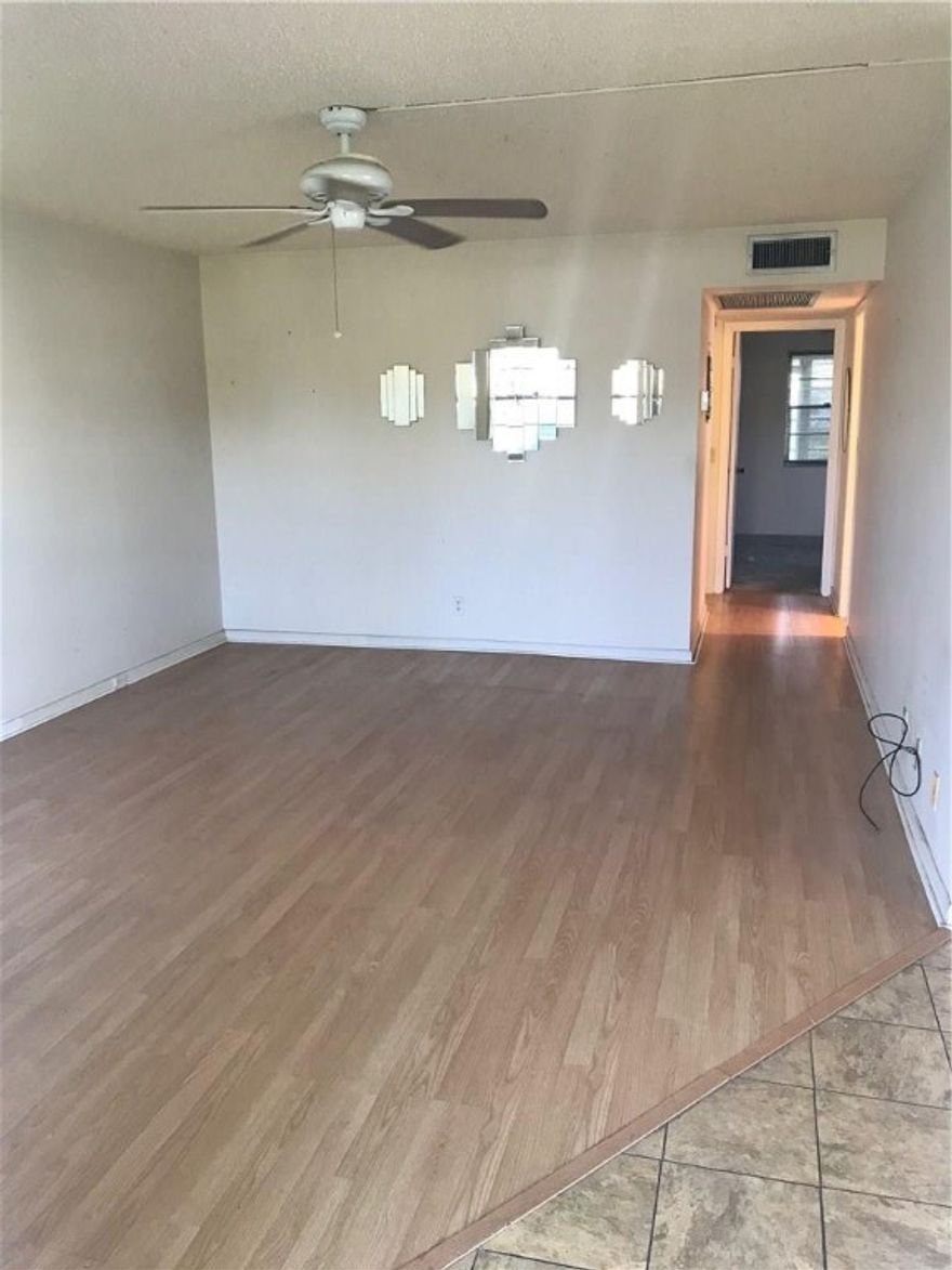 ***CORNER FIRST FLOOR*** 2 BEDROOM 1.5 BATH, STALL SHOWER, HIGHLY DESIRABLE OAKRIDGE AREA, POOL DIRECTLY ACROSS STREET, WALK TO CLUBHOUSE, ENCLOSED FLORIDA ROOM. PUT YOUR OWN FINISHING TOUCH AND MAKE THIS CONDO YOUR PERFECT FLORIDA HOME. ASSOCIATION CLAIMS 55+ COMMUNITY. WORLD CLASS CLUBHOUSE, STATE OF THE ART GYM, FREE MOVIES, BROADWAY SHOWS & MORE! FREE TRANSPORTATION 24 HOUR SECURITY. 3.5 MILES TO BEAUTIFUL DEERFIELD BEACH.
