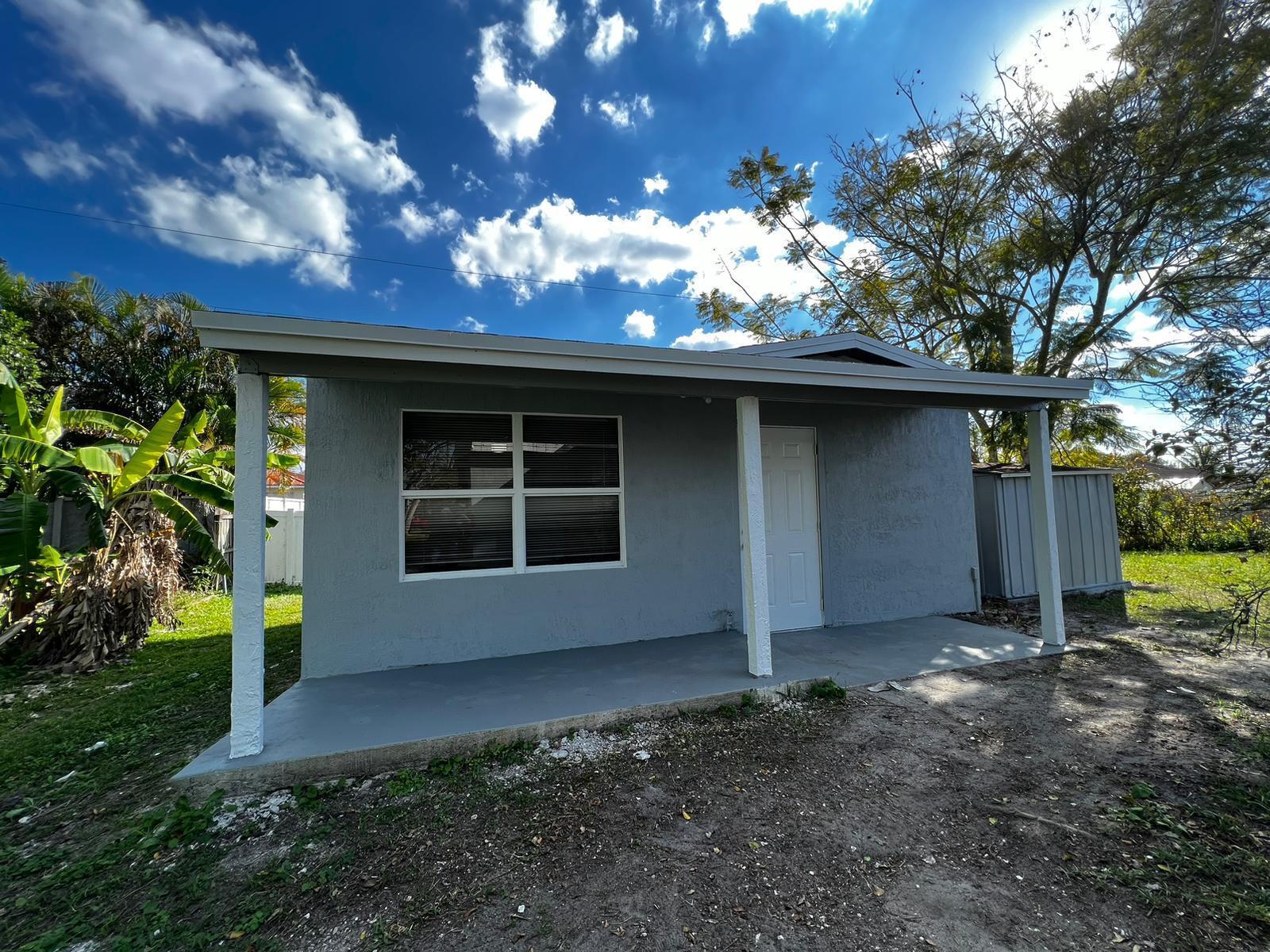 Beautiful Totally Renovated Mother in Law Suite 1/1. New Kitchen with granite counters and stainless steel appliances, New Beautiful 24 x 24 porcelain tile, New Bathroom, New Roof, Freshly Painted, New Fixtures, All UTILITIES Included, Hurry wont Last