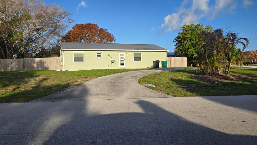 This totally remodeled home is "move-in ready" whether you intend to occupy, or lease.  The home is located in a quiet neighborhood with minimal traffic, and is just minutes away from all major roads, shopping and the beach.  A public boat ramp on the C-24 Canal and the Jessica Clinton Park are located within a few minutes of your front door. The oversized corner lot provides easy access and plenty of space for your boat or camper. The covered patio across the entire back of the home is great for entertaining friends and family. Separate laundry / utility room with washer and drier is a plus.  Metal roof, new flooring, A/C, water heater and appliances provide peace of mind against unexpected future repair costs. Enjoy cooking in the bright and open kitchen with island bar and wine cooler.