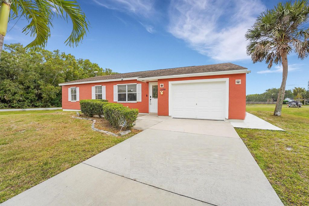 Photo of 2698 SE Melaleuca Boulevard, Port Saint Lucie, FL 34952 (MLS # R10978197)