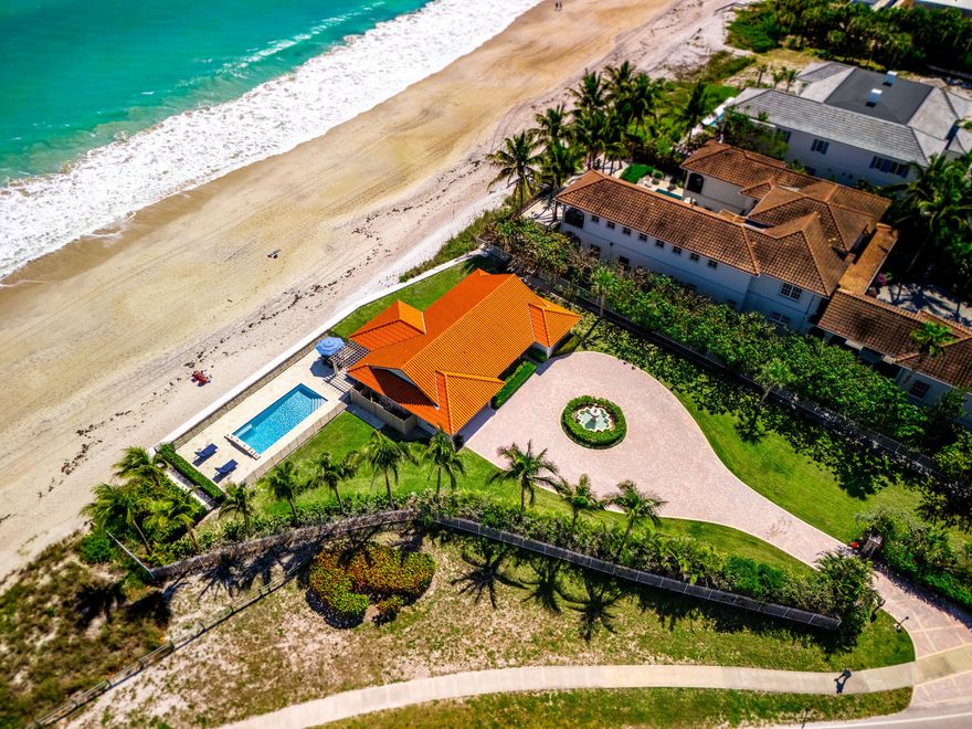 Oceanfront charm meets modern coastal living in this stunning remodeled 3 bedroom, 3 bath home in sought after Central Beach with 261 feet of direct ocean frontage. This gated property features impact glass, vaulted ceilings, bright open interiors, designer finishes, and walls of glass framing breathtaking Atlantic views. All bedrooms offer en suite baths. Enjoy a private pool, pergola terrace, and direct beach access. Walk to Ocean Drive Village for dining and shopping. A rare blend of privacy, personality, and luxury in one of Vero Beach's most desirable locations.