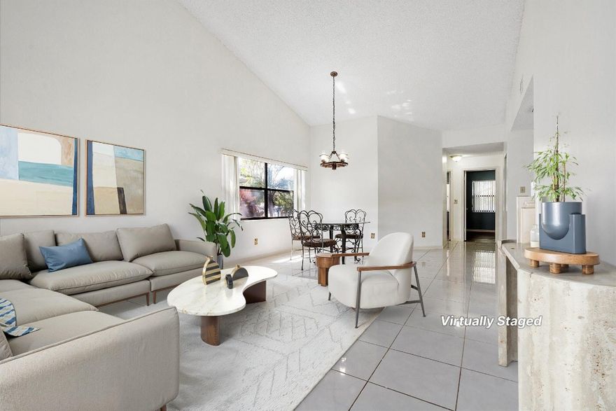 Beautiful move-in ready one-level lakefront villa featuring fresh paint, tile in main living areas, and vinyl wood floors in bedrooms. Open floor plan includes updated kitchen countertops, laundry in pantry, and access to a covered screened patio from the living room and primary suite. The primary offers an ensuite bath and walk-in closet, plus extra patio storage. Enjoy serene lake views with lush tree cover. Grenadier Lakes at Welleby provides 2 assigned parking spaces, pool, clubhouse, tennis courts just across the street and the HOA fee includes building/structure insurance. Conveniently located near Oakland Park Blvd, shops, dining, Sawgrass Expressway, and more. Mortgage savings may be available for buyers of this listing.