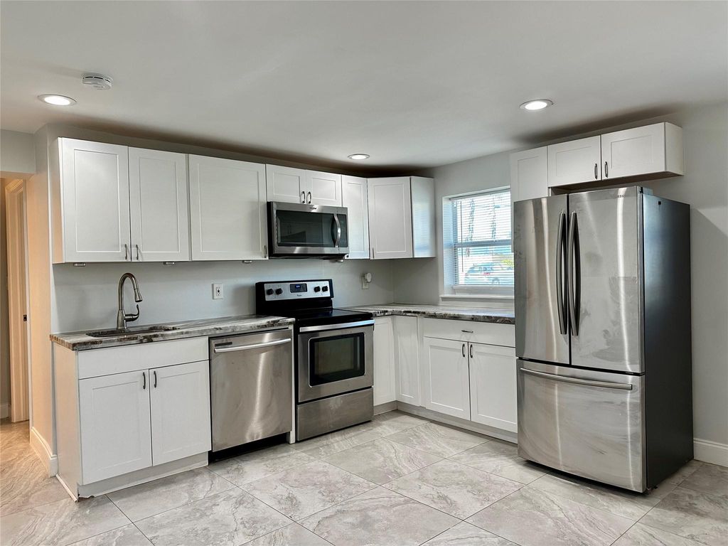 Photo of 1279 NE 40th Place #1, Oakland Park, FL 33334 (MLS # F10474703)