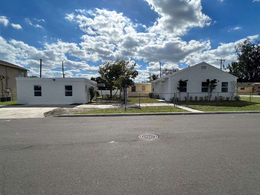 Check out this updated home with detached In-Law Suite (near Northwood Harbor in coastal West Palm Beach. The main house is 864 sq ft & features 3 bedrooms, 1 bathroom (w/ a combo tub/shower), an updated kitchen w/ stainless steel appliances, neutral tile flooring throughout, 2023 AC & 2023 tankless water heater. The detached in-law suite (not a legal rental) is 575 sq ft & features 2 beds, 1 bath, updated kitchen, neutral tile flooring, 2023 tankless water heater, & 2019 AC. Both main house + detached Suite offer lots of natural light, freshly painted interiors/exteriors, & a big yard that is mostly fenced. Located 3 blocks from the Intracoastal Waterway & a short drive to Northwood Village, Downtown WPB, Phil Foster Park, The Square, Singer Island, Brightline station.