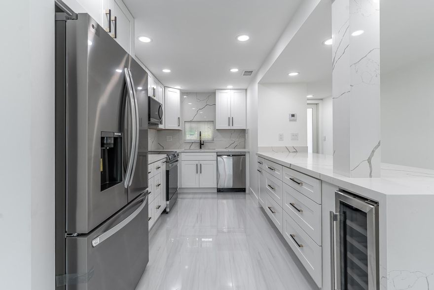 ABSOLUTELY THE MOST BEAUTIFUL, NEWLY & TOTALLY RENOVATED 2BR/2BA third floor apartment in Hollybrook. ALL NEW AMENITIES INCLUDE: Wide Open Kitchen featuring large quartz island, SS Appliances, wine Cooler,  Quartz Countertops, Raised Ceiling, Bright LED Lighting & more. Washer/Dryer inside. Large ceramic tile throughout. Impact Windows, slider and door. Recreation Lease PAID IN FULL. PGA 11th fairway and  water views. Amenities include Restaurant, Billiard Room, Bbq/Picnic Area, Clubhouse, Courtesy Bus, Exercise Room, Heated Pool, Library, Putting Green, Sauna, Shuffleboard, Tennis, Pickle Ball, Vehicle Wash Area, Electric Car Charging Station. Close to shopping, dining & highways. 15 min. to the beach. ABSOLUTELY THE VERY BEST!