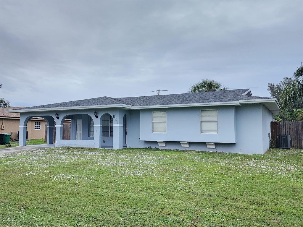 Photo of 631 SW Curry Street, Port Saint Lucie, FL 34983 (MLS # R11039614)