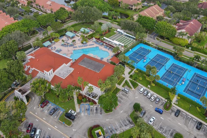 Enjoy living in this first-floor condominium with a garden view. The Patio has a screen and a glass door. Engage in a resort Lifestyle with exceptional club facilities, including a café. Split bedroom plan known as the Imperial Model. Eat-in Kitchen with updated stainless steel appliances. Newly installed carpet in living room and bedrooms. The Patio is spacious and accommodates a round table and chairs and then some!  South exposure on the back of the property is best for sun and breeze.  Atrium front entry creates an open feeling. Ample guest parking along with reserved parking.  Satellite pool for Alexandra in addition to the main club pool.  No leasing in the first years of ownership. All ages welcomed.   Peaceful and quiet backyard!