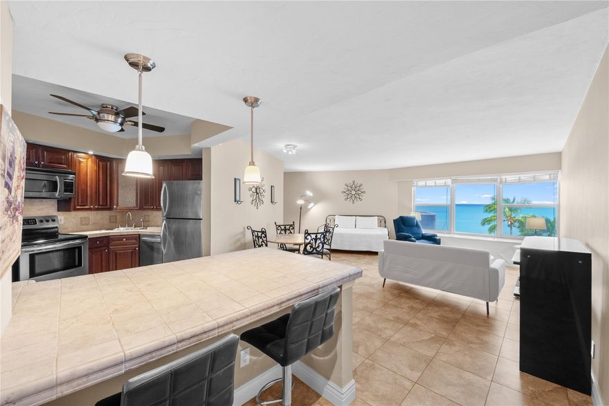 Enjoy direct ocean views the moment you walk in! This spacious studio is the perfect beach rental without the high price tag. Walking distance to 33rd street with a ton of entertainment and good eats. Only a few minutes from famous Fort Laderdale beach & Las Olas where you can enjoy tons of restaurants, shops, bars & more! Fully renovated, it features a large open kitchen with eat-at bar. The bright living area showcases stunning ocean views, while the updated bathroom offers a walk-in shower. Impact windows throughout. Building amenities include a new resort-style pool, updated tiki bar with grills, kayak racks, fitness center, valet, and direct beach access. Walking distance to grocery store, pharmacy, restaurants, shops and more. Move right in and start living the beachfront lifestyle!