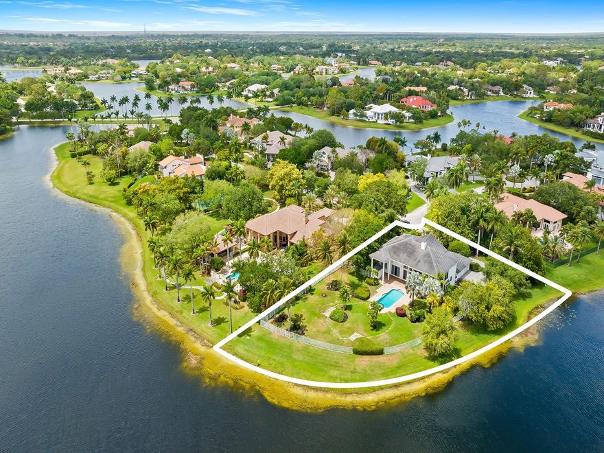 Stunning 6BD/8BA/3CG estate on a 1.38-acre fenced lakefront lot w/panoramic water views! Over 5,500sf of luxury living with soaring 30ft coffered ceilings, floor-to-ceiling glass, & 40ft heated pool/spa. Open layout w/ 24" Saturnia marble, modern chandeliers, marble fireplace, & mahogany/onyx wet bar. Chef’s kitchen w/Miele & Subzero appliances. Downstairs primary suite w/ sitting room, 3 walk-ins, & his/her marble baths. One guest ensuite off of kitchen and other ensuite bedroom can be also used as a den/office.  Upstairs: 3BD/3BA, media room, glass-enclosed office w/ lake views. New roof (2019) and several bathrooms recently renovated, redone driveway, cabana bath, 3-car garage, lush grounds. Rare opportunity to own a showpiece waterfront estate in the heart of Windmill Ranch Estates!