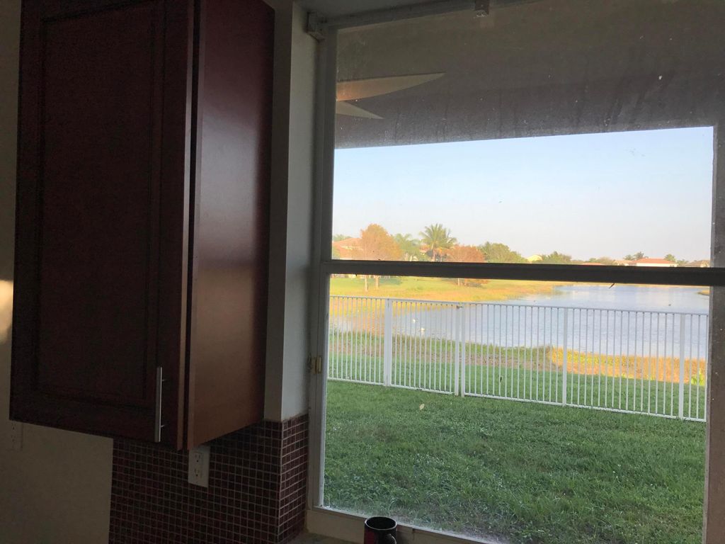 Photo of 6292 Shadow Tree Lane, Lake Worth, FL 33463 (MLS # B26022110)