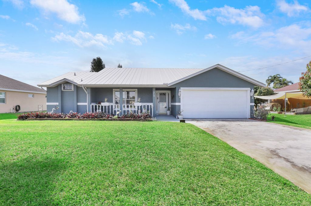Photo of 470 SE Nome Drive, Port Saint Lucie, FL 34984 (MLS # R10970780)