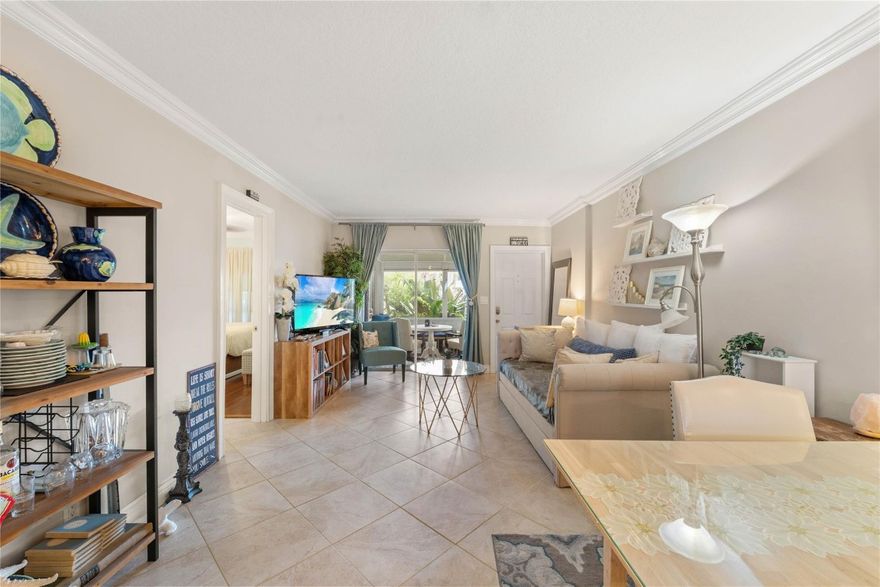 Welcome to this charming corner condo in Lighthouse Point. What truly sets this home apart is its exquisite screened lanai, a delightful space for gatherings, dining, or morning coffee. The open kitchen boasts stainless steel appliances. This home is loaded with upgrades, including a new electrical system, plantation shutters, Bamboo wood floors in the bedrooms, & Bosch Washer and Dryer. Beacon House is well managed with no assessments, completed 40-year recertification, & reserves. Nestled among million-dollar homes, the peninsula is dog friendly & perfect for daily walks. Close to Nauti Dawg, pet friendly restaurant. You'll appreciate being just minutes away from the ocean. Comprehensive surveillance with cameras on the streets adds to the overall security of this lovable neighborhood.