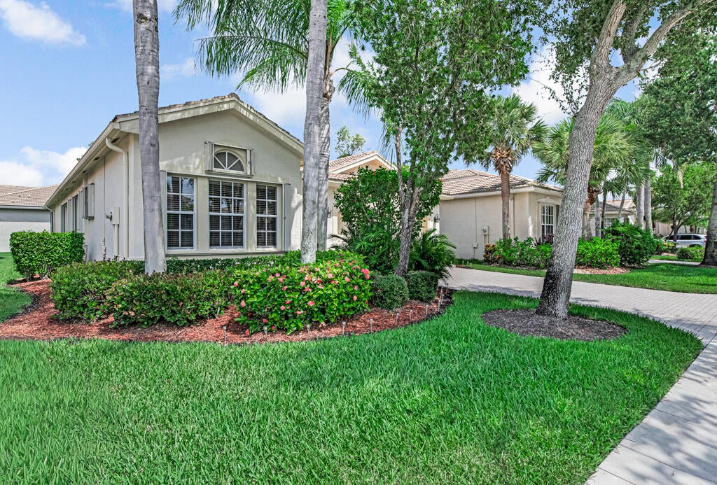 Photo of 7718 OCEAN SUNSET Drive, Lake Worth, FL 33467 (MLS # B26055497)