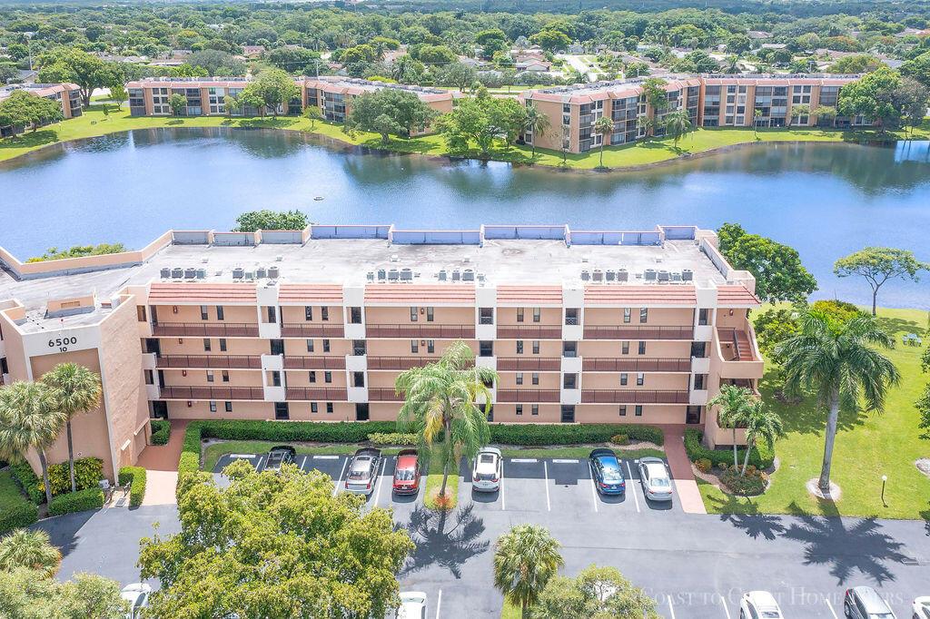 Beautiful updated waterfront condo, first floor end unit with the best views in a 55+ community. Shopping, restaurants, casino and more just minutes away. Complex has a 1.1 mile jogging/biking path, shuffle boards, 3 heated pools, 3 clubhouses, and billiards. Fish and kayak in the lake just outside your back door. Unit has new impact windows and sliders. New plank flooring, Stainless steel kitchen appliances are less than two years old. Front storm glass door in entrance is less than one year old. Back patio screen, framing and tile less than one year old. Both bathrooms remodeled this year. Doors in unit, including pocket doors are all newly updated. House has Smart thermostat and smart oven and hard wired Ethernet. Cable tv plus HBO and water is included in the HOA fees.